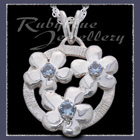 Sterling Silver 'Circle of Flowers' Pendant set with December Birthstones Image